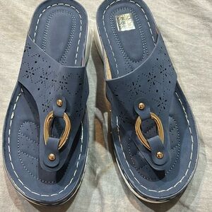 New slate blue faux suede with white heel size 39 but runs more like a 38